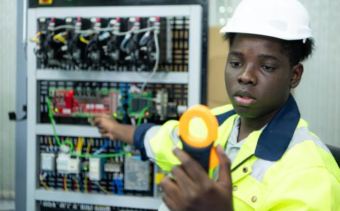 portrait-technician-working-with-digital-multimeter-test-electrical-system_159755-11474